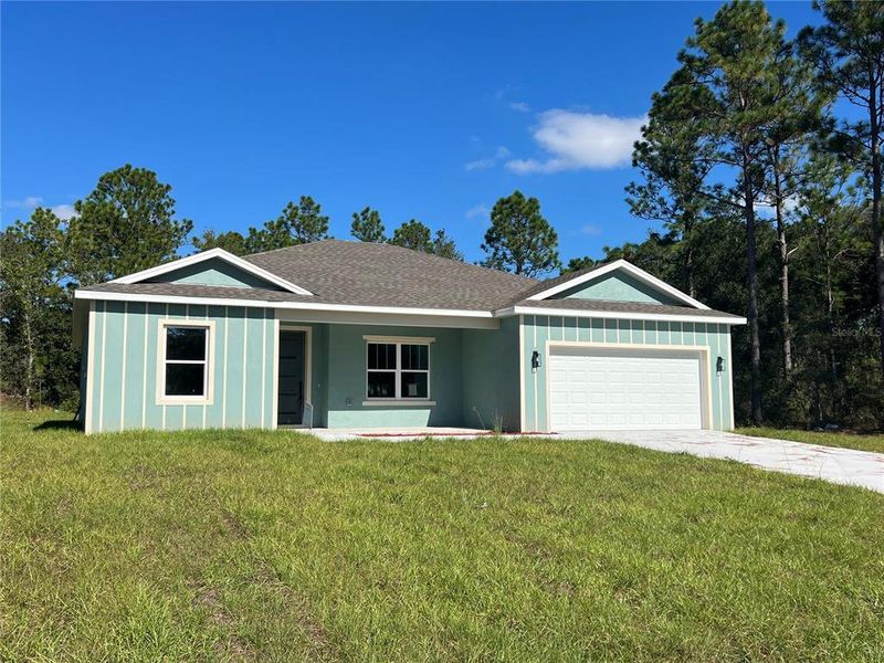 Front exterior of a new home in , Citrus Springs, FL, highlighting curb appeal (Image 21).