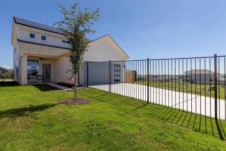 Front exterior of a new home in Whisper Valley, Manor, TX, highlighting curb appeal (Image 29). Front exterior of a new home in Whisper Valley, Manor, TX, highlighting curb appeal (Image 29).