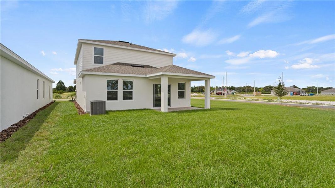 Front exterior of a new home in Willowbrook North, Winter Haven, FL, highlighting curb appeal (Image 19).