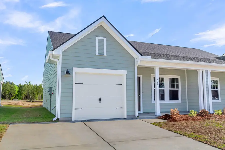 Front exterior of a new home in , Ravenel, SC, highlighting curb appeal (Image 2). Front exterior of a new home in , Ravenel, SC, highlighting curb appeal (Image 2).