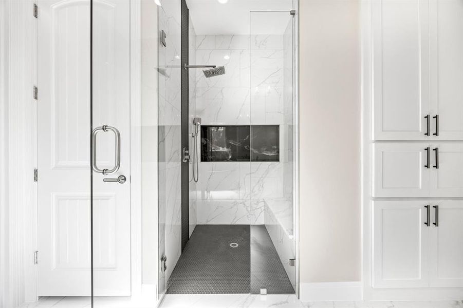 Bathroom with walk in shower and tile patterned floors