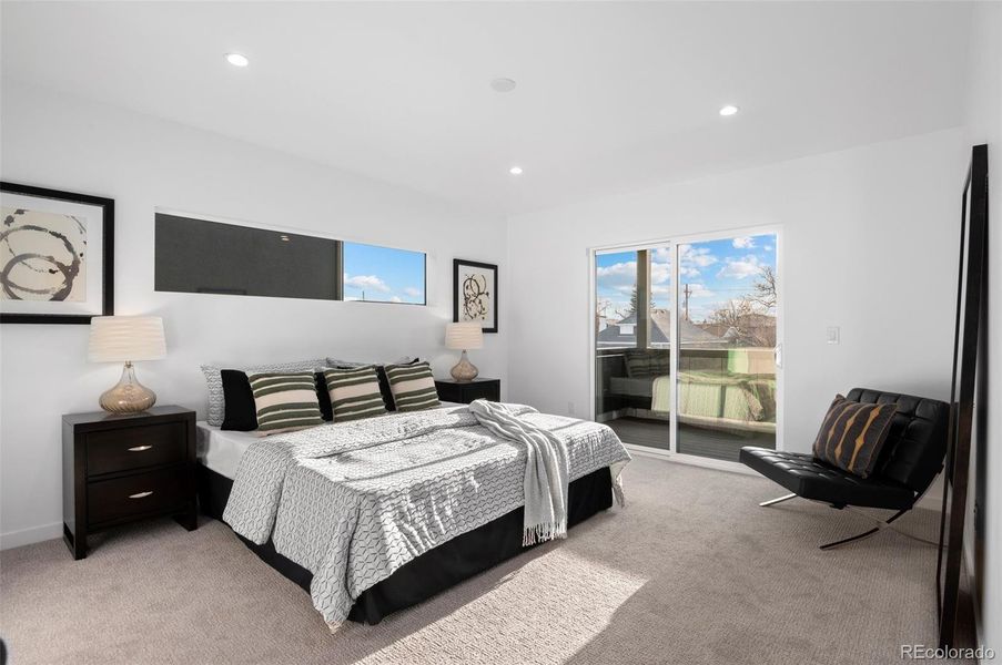 Primary bedroom with private balcony