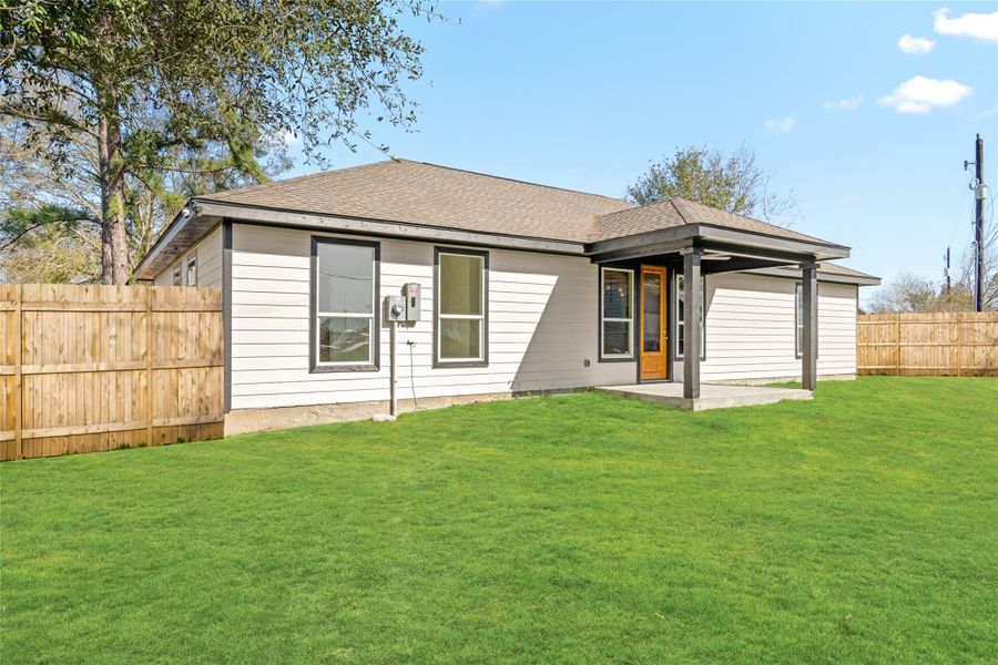 Spacious backyard view with a seamless blend of indoor-outdoor living, ideal for family fun or weekend gatherings.