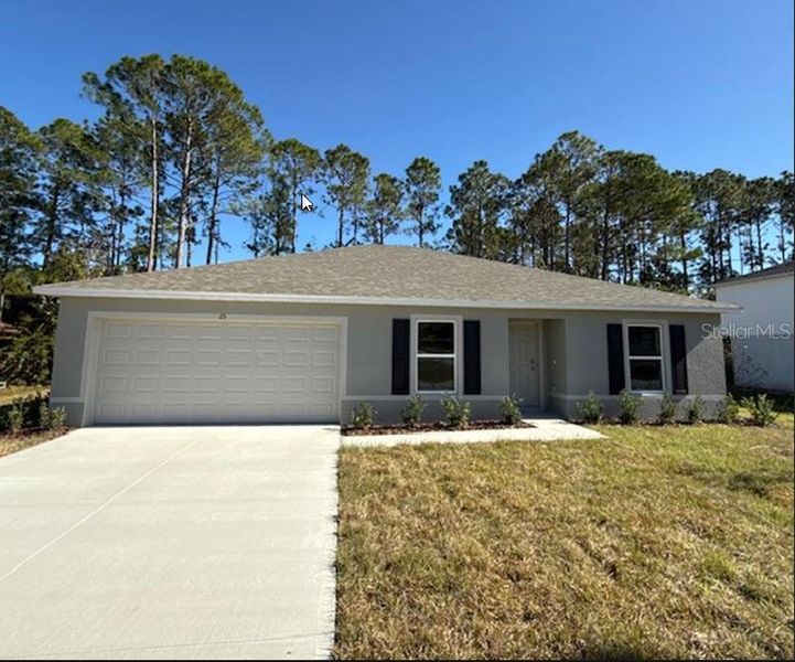 Front exterior of a new home in Palm Coast: Value Collection, Palm Coast, FL, highlighting curb appeal (Image 1).