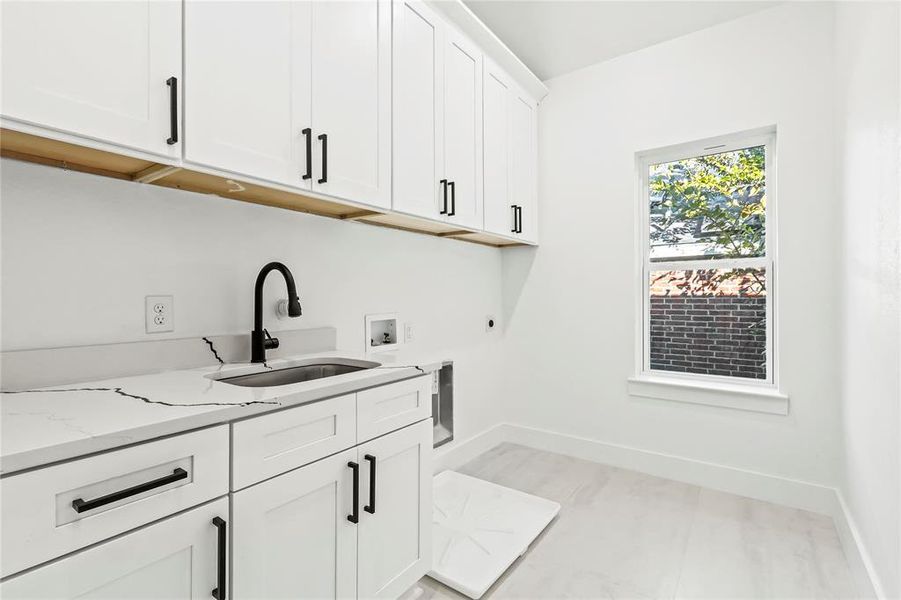 Laundry room with cabinet space, washer hookup, and electric dryer hookup