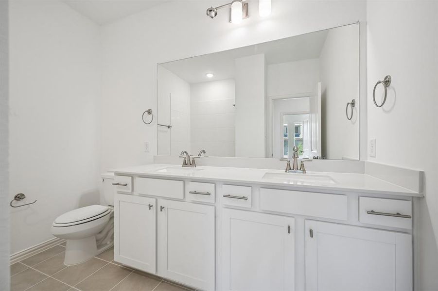 Guests will feel right at home in this beautifully finished guest bath.