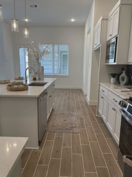 Representative furnished interior of a home built from the Mickelson by Chesmar Homes in Riceland Alley Loads, Mont Belvieu (Image 19).
