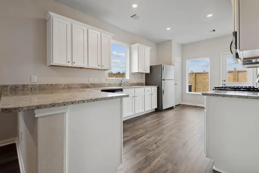 Furnished interior view inside a new home in Sweetwater Ridge, Conroe (Image 4).