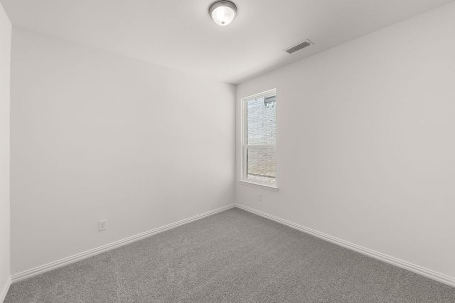 Representative unfurnished interior of a home built from the Cypress by UnionMain Homes in Edgewater, Fate (Image 40).