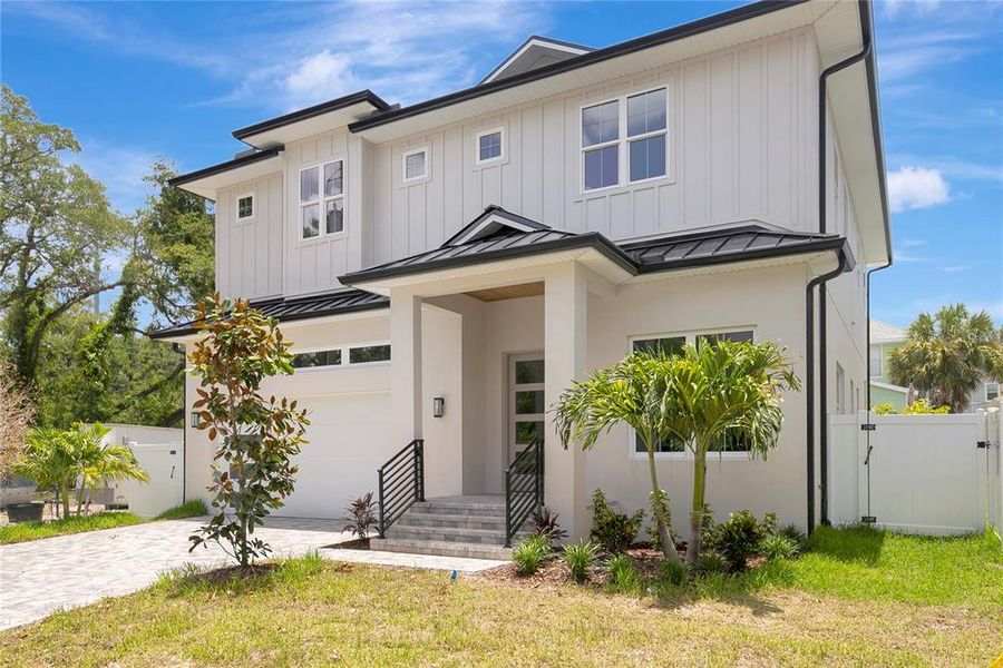 Front exterior of a new home in , Tampa, FL, highlighting curb appeal (Image 26).