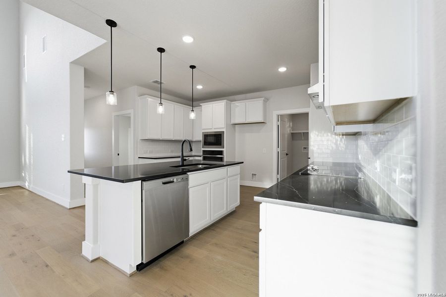 Furnished interior view inside a new home in The Woodlands at Medina Hills, Mico (Image 14).