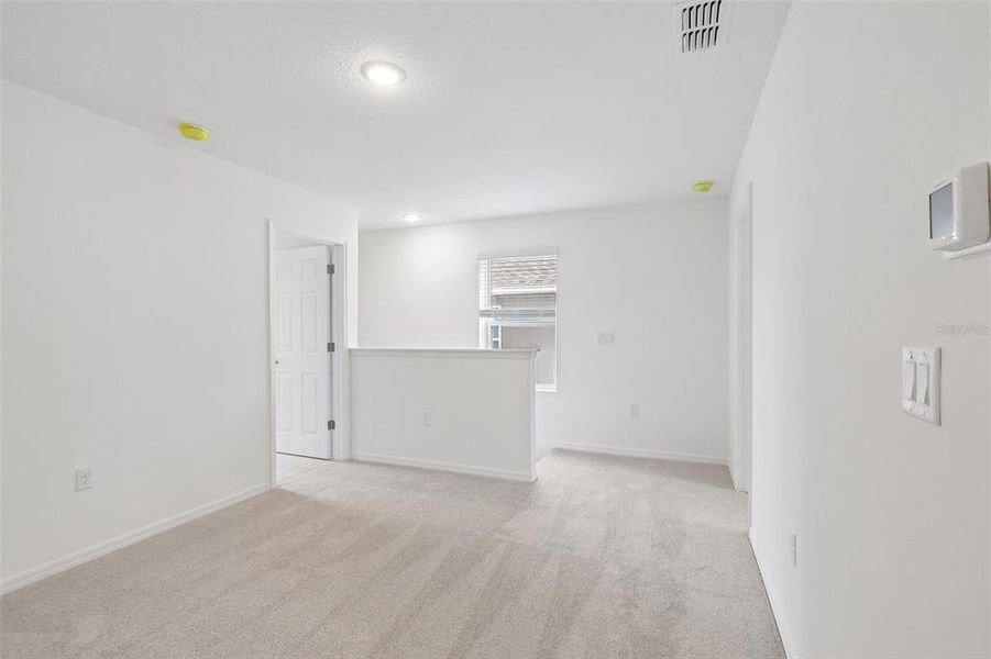 Spacious, unfurnished interior of a new home in Eagletail Landings, Howey-in-the-Hills (Image 18).