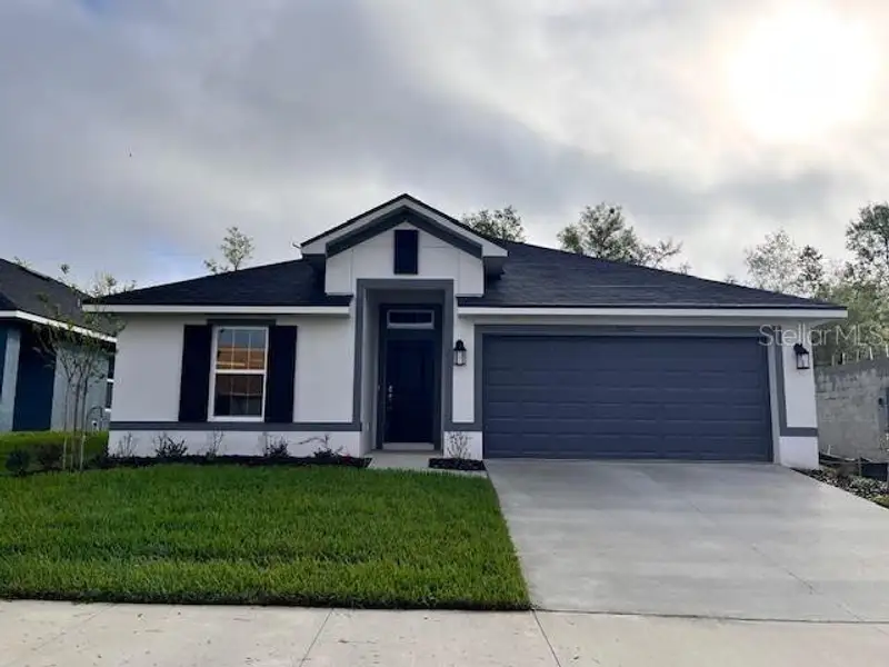 Front exterior of a new home in Abbey Glen, Dade City, FL, highlighting curb appeal (Image 2). Front exterior of a new home in Abbey Glen, Dade City, FL, highlighting curb appeal (Image 2).