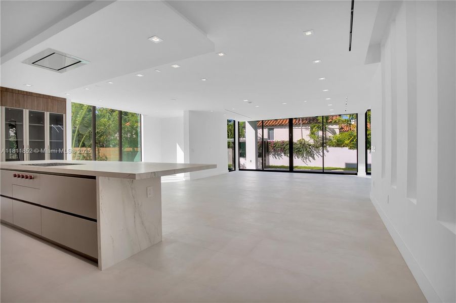 kitchen and backyard sliding view as one enters the main floor. kitchen and backyard sliding view as one enters the main floor.