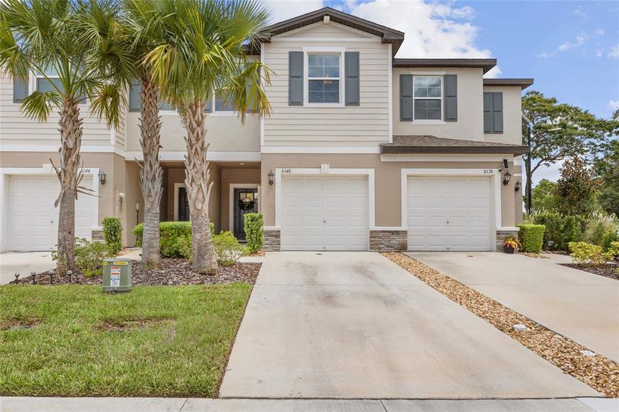 Front exterior of a new home in , Land O' Lakes, FL, highlighting curb appeal (Image 2). Front exterior of a new home in , Land O' Lakes, FL, highlighting curb appeal (Image 2).