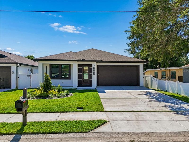 Front exterior of a new home in , Tampa, FL, highlighting curb appeal (Image 31).