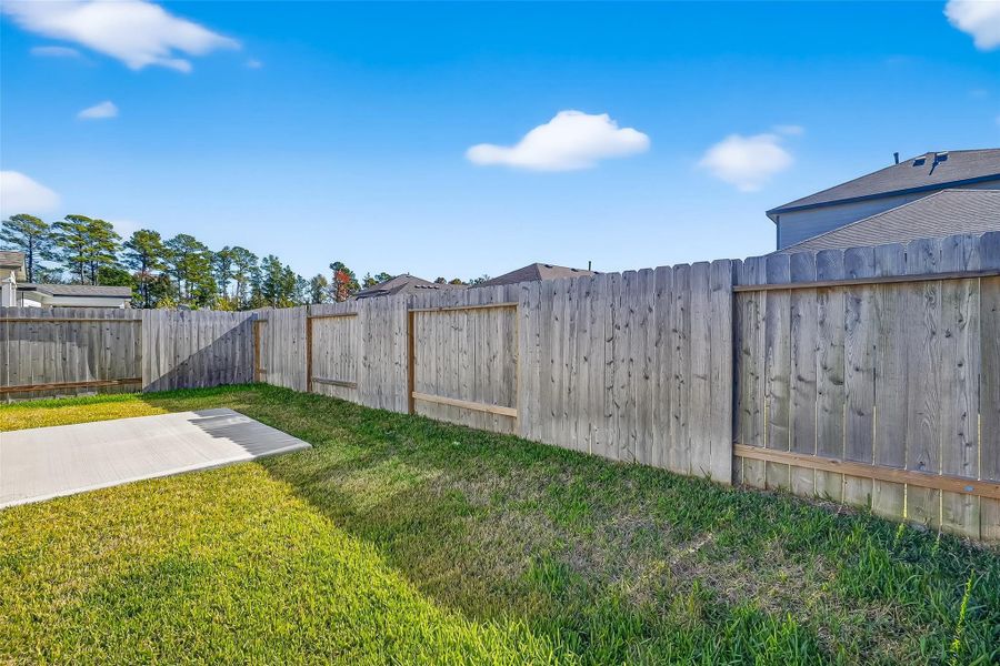 Exterior details and patio area of a home in , Magnolia (Image 3). Exterior details and patio area of a home in , Magnolia (Image 3).