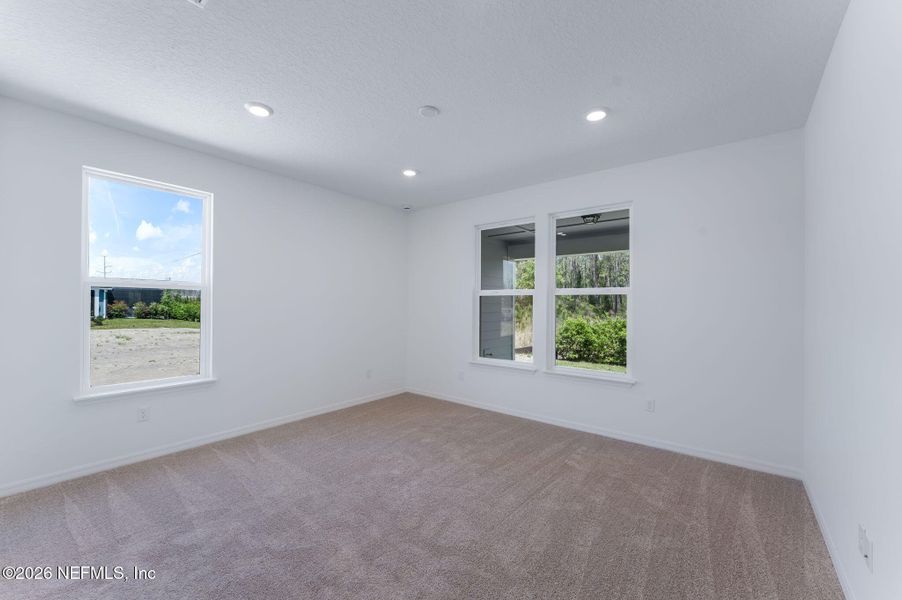 Spacious, unfurnished interior of a new home in Del Webb Wildlight, Yulee (Image 33).