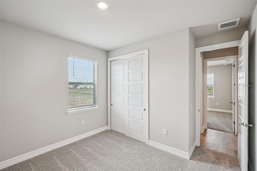 Spacious, unfurnished interior of a new home in Crescent Lakes - Signature Series, Punta Gorda (Image 29).