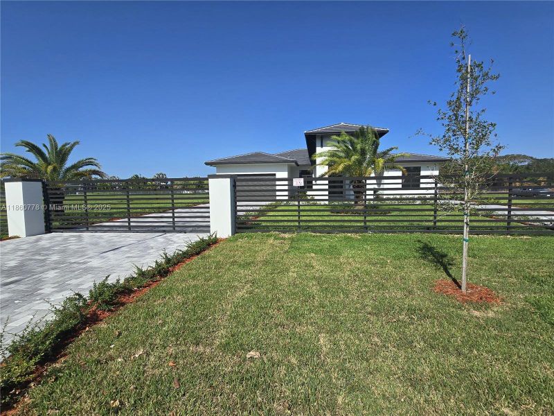 Front exterior of a new home in , Homestead, FL, highlighting curb appeal (Image 34).
