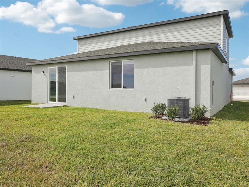 Exterior details and patio area of a home in The Grove at Stuart Crossing - Classic Series, Bartow (Image 23).