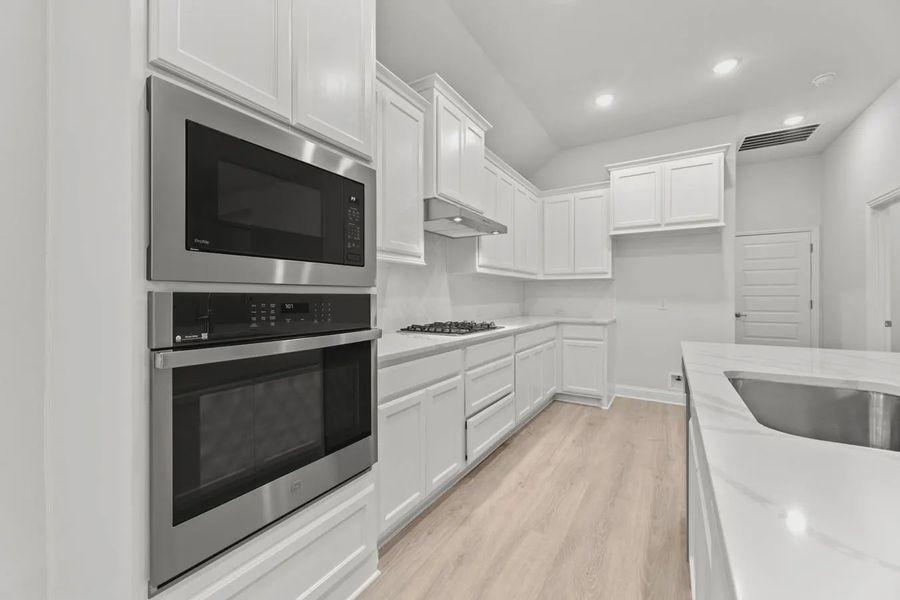 Representative furnished interior of a home built from the Bridgeport by Chesmar Homes in Summer Crest, Crowley (Image 3).