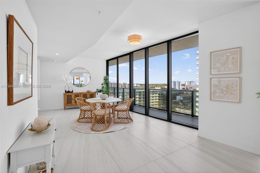 Open dining area with floor to ceiling glass, adjacent to chef’s kitchen and terrace for seamless indoor outdoor entertaining. This area is also a possible den / 4th bedroom as per the builders plans. Unit is a 4 bedroom per tax roll