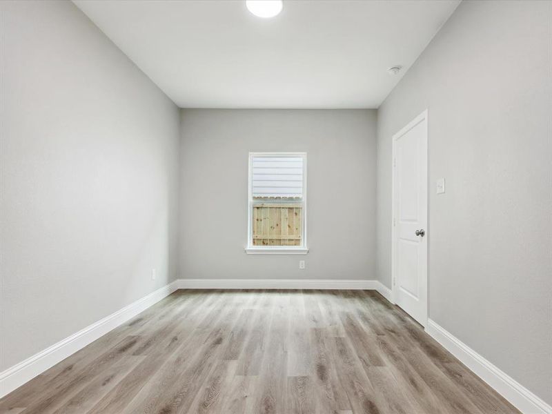 Unfurnished room with light hardwood / wood-style floors