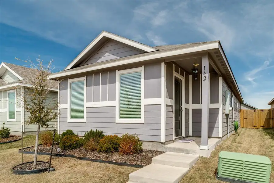 Front exterior of a new home in Tillage Farms, Princeton, TX, highlighting curb appeal (Image 2). Front exterior of a new home in Tillage Farms, Princeton, TX, highlighting curb appeal (Image 2).