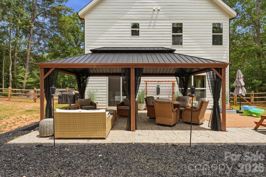 Exterior details and patio area of a home in , Troutman (Image 25).