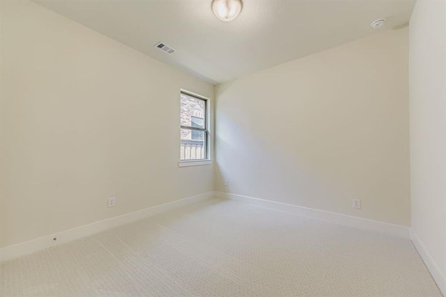 Spare room with carpet flooring and baseboards
