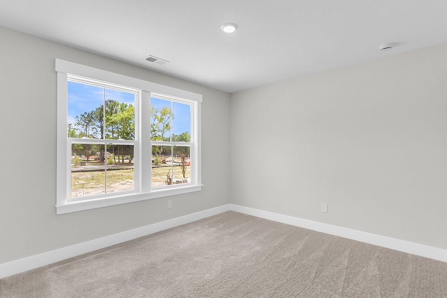 Spacious, unfurnished interior of a new home in Pineland Preserve, Summerville (Image 50).