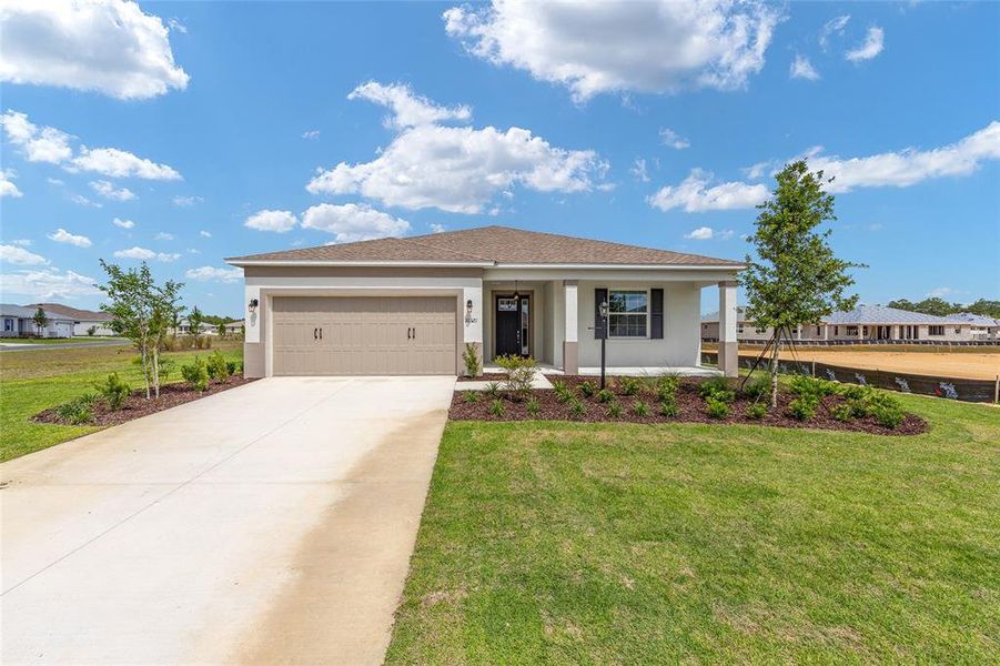 Front exterior of a new home in , Ocala, FL, highlighting curb appeal (Image 17). Front exterior of a new home in , Ocala, FL, highlighting curb appeal (Image 17).