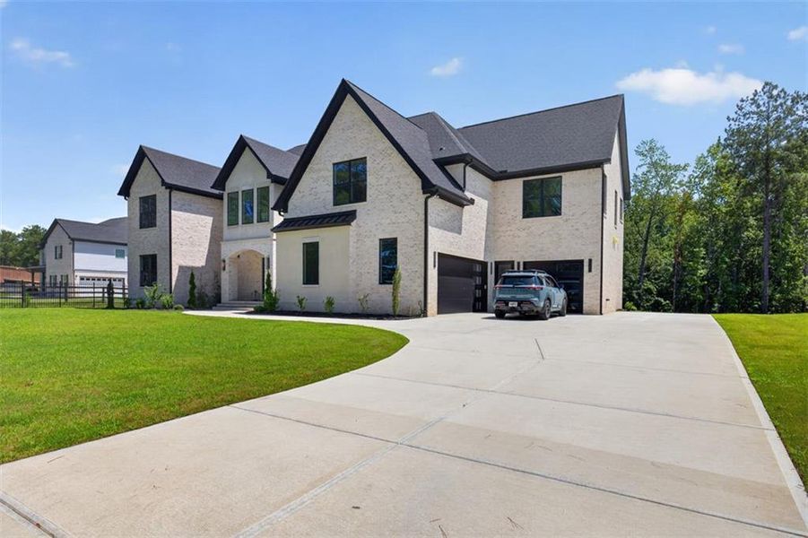 Front exterior of a new home in , Buford, GA, highlighting curb appeal (Image 27).