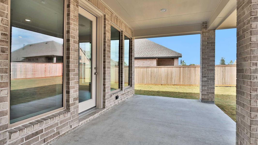 Exterior details and patio area of a home in Bridgeland, Cypress (Image 3).