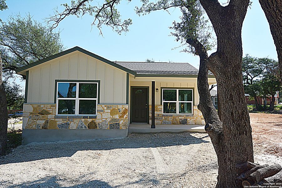 Front exterior of a new home in , Spring Branch, TX, highlighting curb appeal (Image 1). Front exterior of a new home in , Spring Branch, TX, highlighting curb appeal (Image 1).