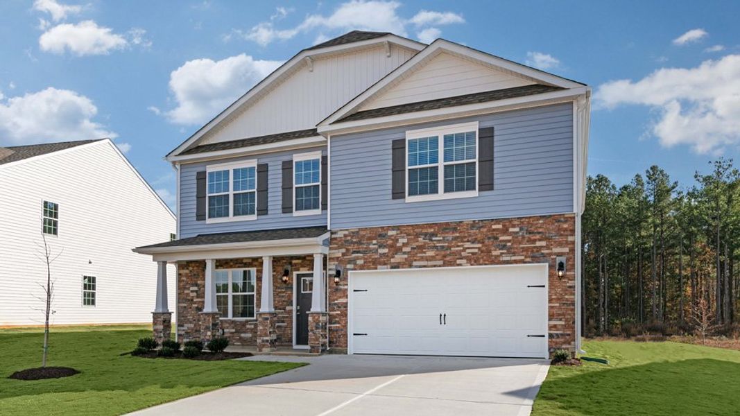 Front exterior of a new home in Shahbain Reserve, Raeford, NC, highlighting curb appeal (Image 2). Front exterior of a new home in Shahbain Reserve, Raeford, NC, highlighting curb appeal (Image 2).