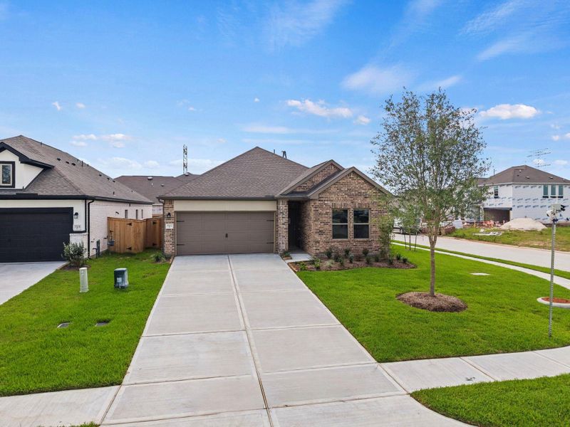 Front exterior of a new home in Windrose Green, Angleton, TX, highlighting curb appeal (Image 1). Front exterior of a new home in Windrose Green, Angleton, TX, highlighting curb appeal (Image 1).