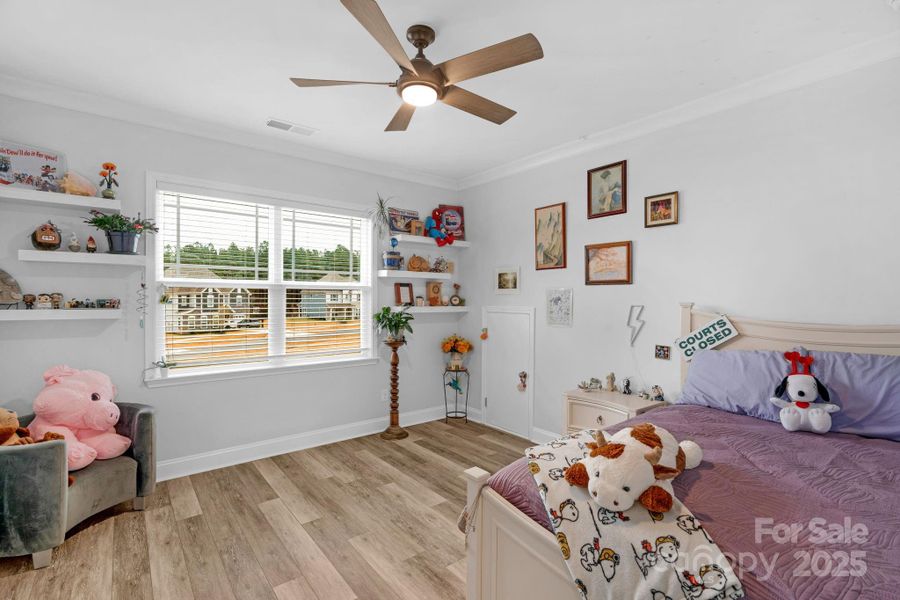 Secondary bedroom on the second floor with custom walk-in closet