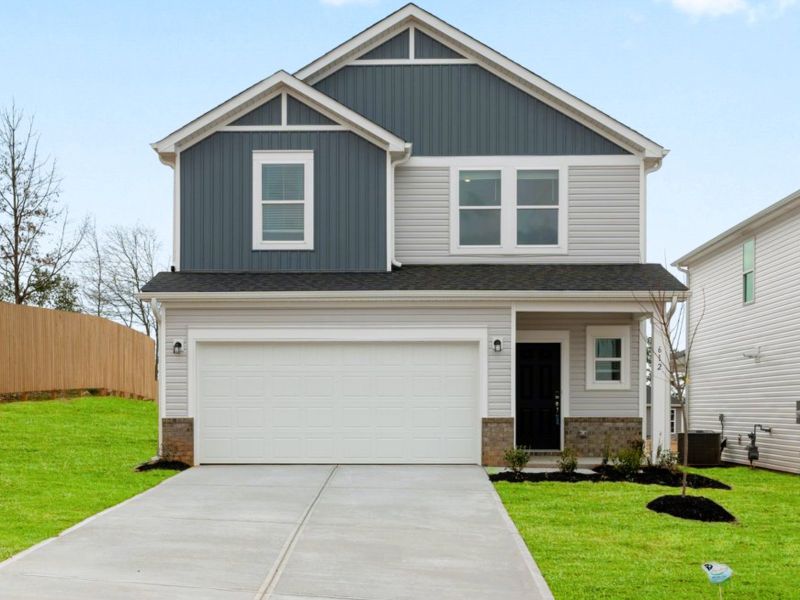 Front exterior of a new home in Brayfield Manor - Heritage Collection, Wellford, SC, highlighting curb appeal (Image 1). Front exterior of a new home in Brayfield Manor - Heritage Collection, Wellford, SC, highlighting curb appeal (Image 1).