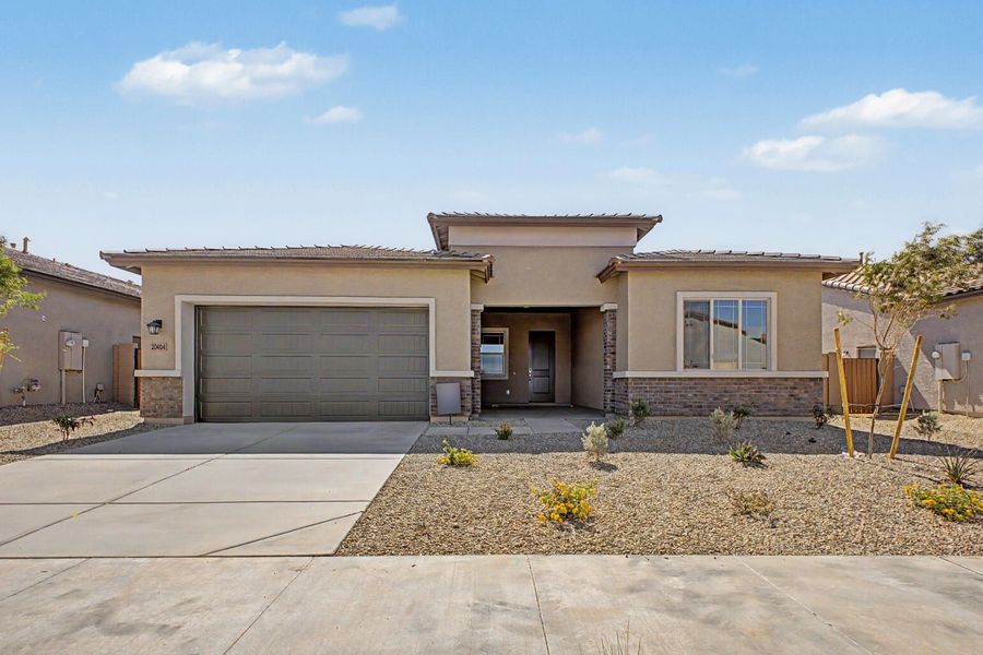 Front exterior of a new home in Frontera, Surprise, AZ, highlighting curb appeal (Image 1). Front exterior of a new home in Frontera, Surprise, AZ, highlighting curb appeal (Image 1).