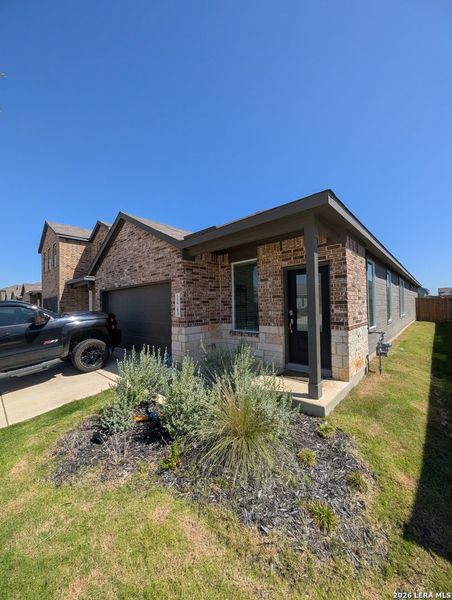 Exterior details and patio area of a home in Rose Valley, Converse (Image 25).