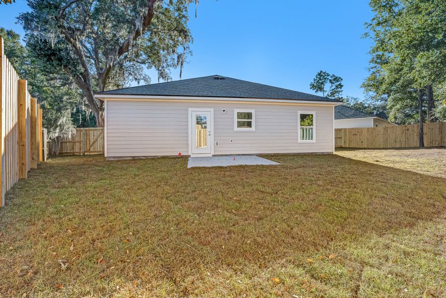 Exterior details and patio area of a home in Live Oak Cottages, Freeport (Image 3).