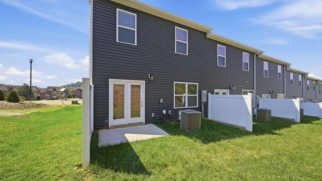 Exterior details and patio area of a home in The Arbor Townhomes, Kingsport (Image 4).
