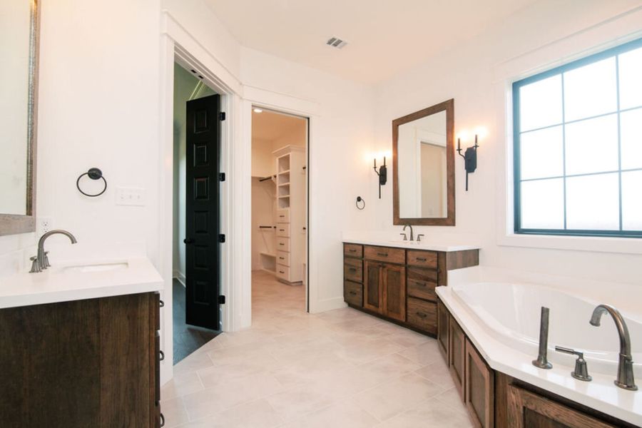 Representative furnished interior of a home built from the The Julia by Reece Homes in Pebble Creek, College Station (Image 44).