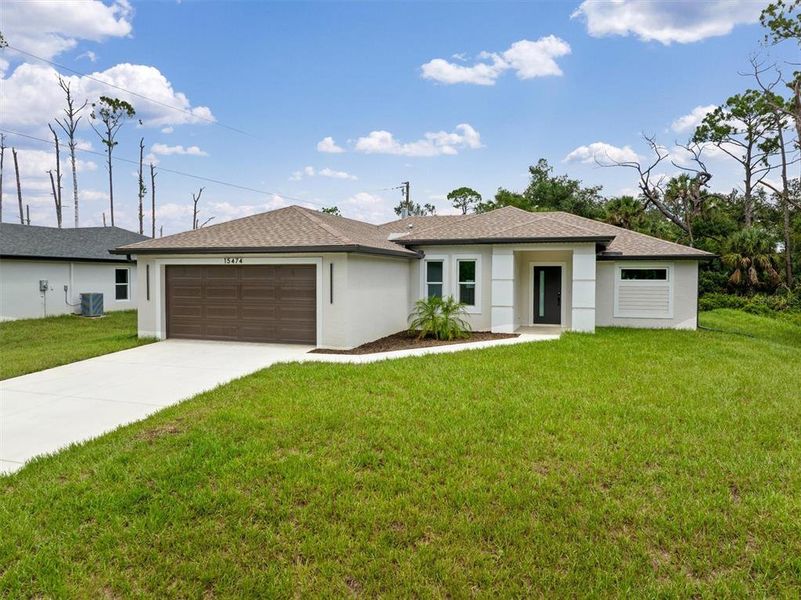 Front exterior of a new home in , Port Charlotte, FL, highlighting curb appeal (Image 29). Front exterior of a new home in , Port Charlotte, FL, highlighting curb appeal (Image 29).