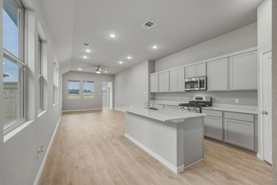 Kitchen in the Cedar home plan by Trophy Signature Homes – REPRESENTATIVE PHOTO
