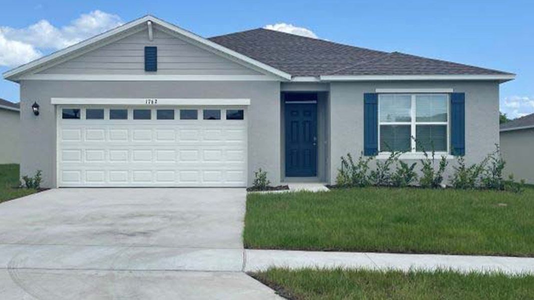 Front exterior of a new home in Willowbrook South, Winter Haven, FL, highlighting curb appeal (Image 1). Front exterior of a new home in Willowbrook South, Winter Haven, FL, highlighting curb appeal (Image 1).