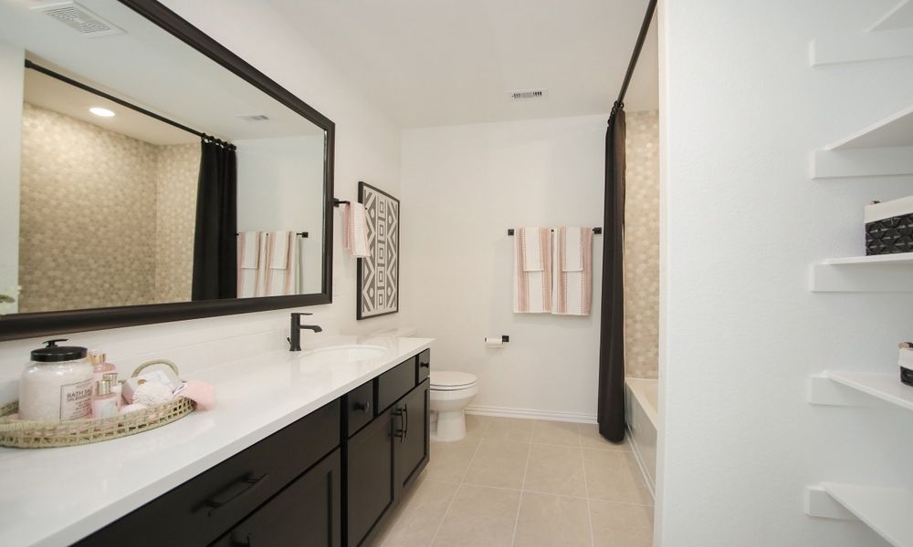 Representative furnished interior of a home built from the Lexington Series - Denton by Brightland Homes in Beamer Villas, Friendswood (Image 17).