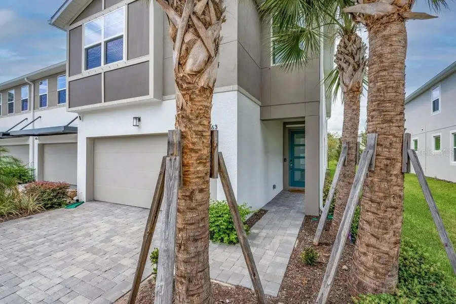 Exterior details and patio area of a home in Bloomingdale Townes, Brandon (Image 3).